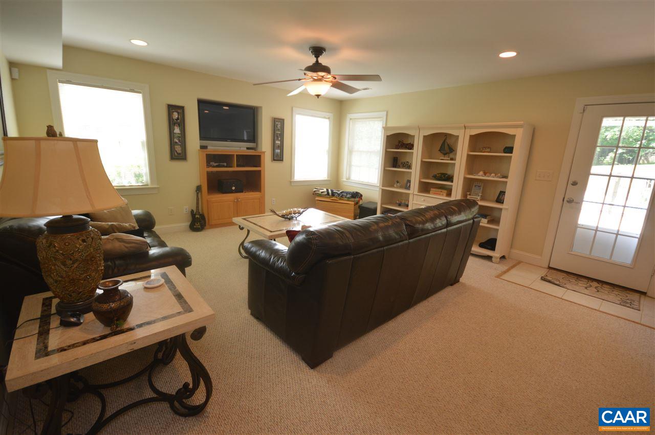 401 Sam Durrer Road Ruckersville, VA 22968 - Photo 36 of 50 a living room with furniture windows and a flat screen tv