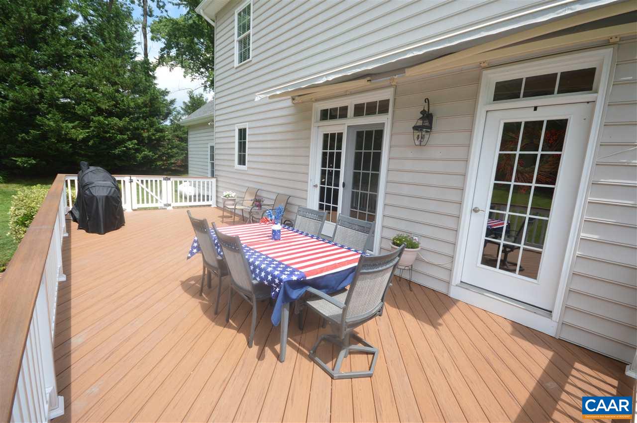401 Sam Durrer Road Ruckersville, VA 22968 - Photo 49 of 50 a backyard of a house with wooden floor table and chairs