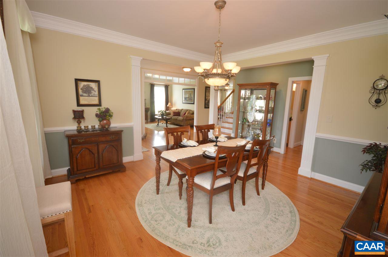 401 Sam Durrer Road Ruckersville, VA 22968 - Photo 5 of 50 a dining room with furniture a chandelier and wooden floor