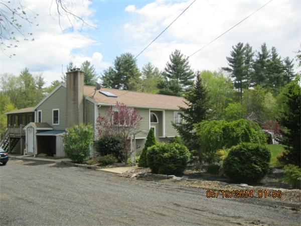 262 Czesky Road Hardwick, MA 01037 - Photo 1 of 14 a front view of a house with a yard and garage