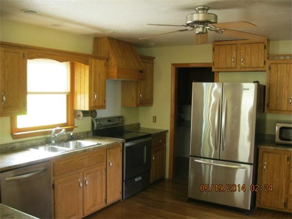 262 Czesky Road Hardwick, MA 01037 - Photo 11 of 14 a kitchen with a refrigerator a sink and a window