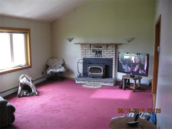 262 Czesky Road Hardwick, MA 01037 - Photo 14 of 14 a living room with furniture and a fireplace