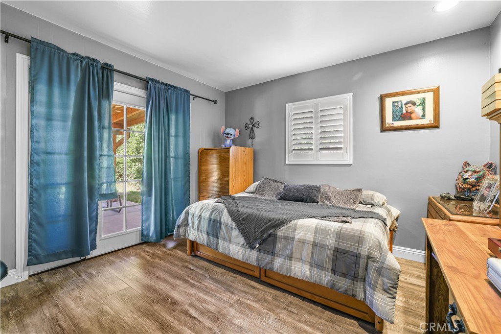 4106 Goodman Street Riverside, CA 92503 - Photo 12 of 20 a bedroom with two beds and a window