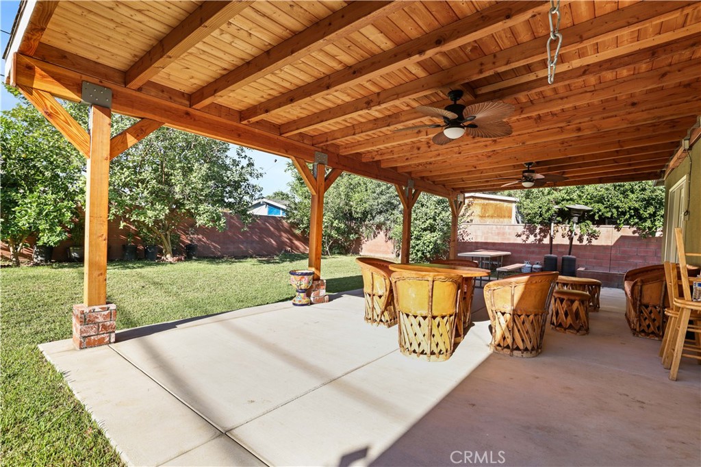 4106 Goodman Street Riverside, CA 92503 - Photo 17 of 20 a view of a patio with a table and chairs under an umbrella