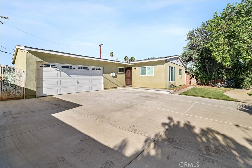 4106 Goodman Street Riverside, CA 92503 - Photo 2 of 20 a view of house with yard and trees in the background