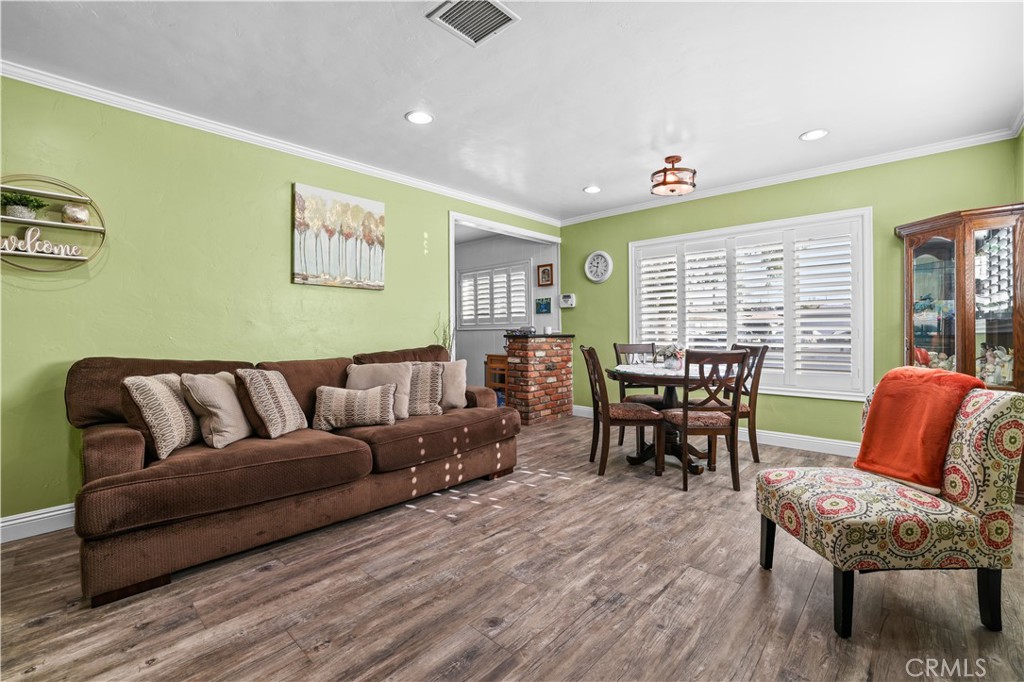 4106 Goodman Street Riverside, CA 92503 - Photo 3 of 20 a living room with furniture and wooden floor