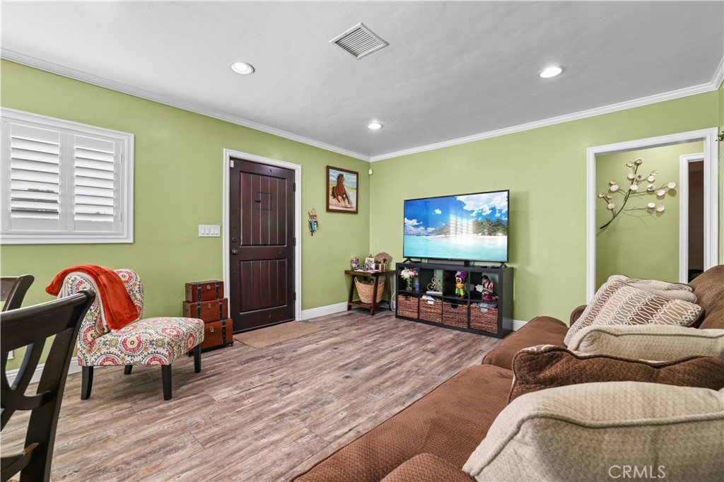 4106 Goodman Street Riverside, CA 92503 - Photo 4 of 20 a living room with furniture and a flat screen tv