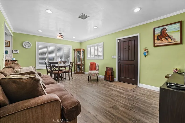 a living room with furniture and a lamp