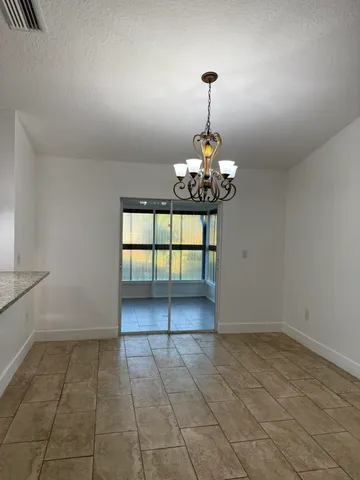a view of a room with a chandelier