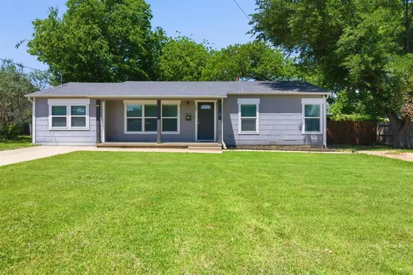 front view of a house with a yard