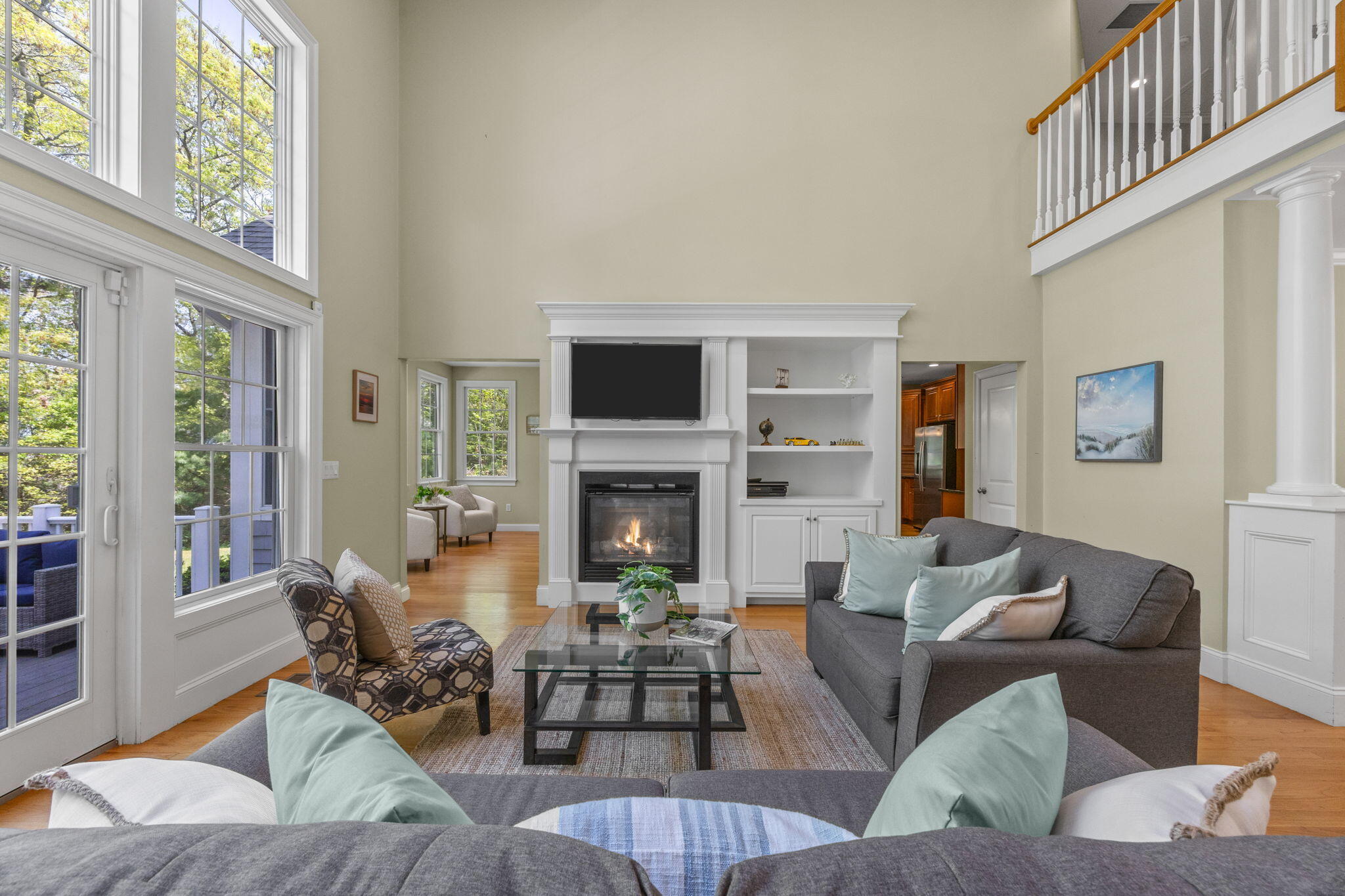 17 Payamps Road Mashpee, MA 02649 - Photo 28 of 72 a living room with furniture a fireplace and a large window