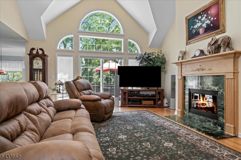 15 Bracken Hill Road Hamburg, NJ 07419 - Photo 7 of 44 a living room with furniture and a flat screen tv