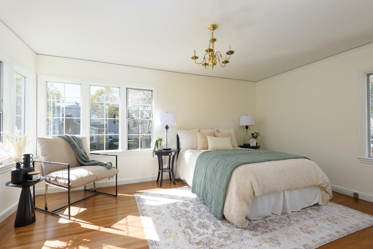 424 Bloomfield Road Burlingame, CA 94010 - Photo 11 of 14 a spacious bedroom with a bed and wooden floor