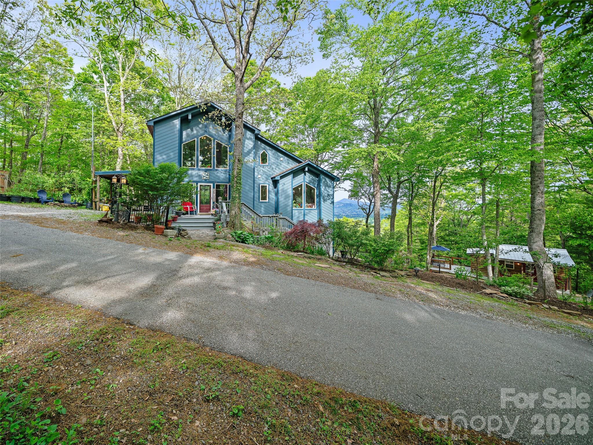 228 Continental Divide Road Spruce Pine, NC 28777 - Photo 46 of 48 a view of a house with a street