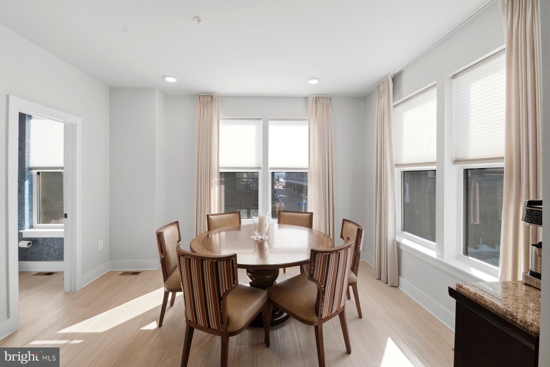 100 Glass Lane Baltimore, MD 21230 - Photo 17 of 36 a view of a dining room with furniture window and wooden floor
