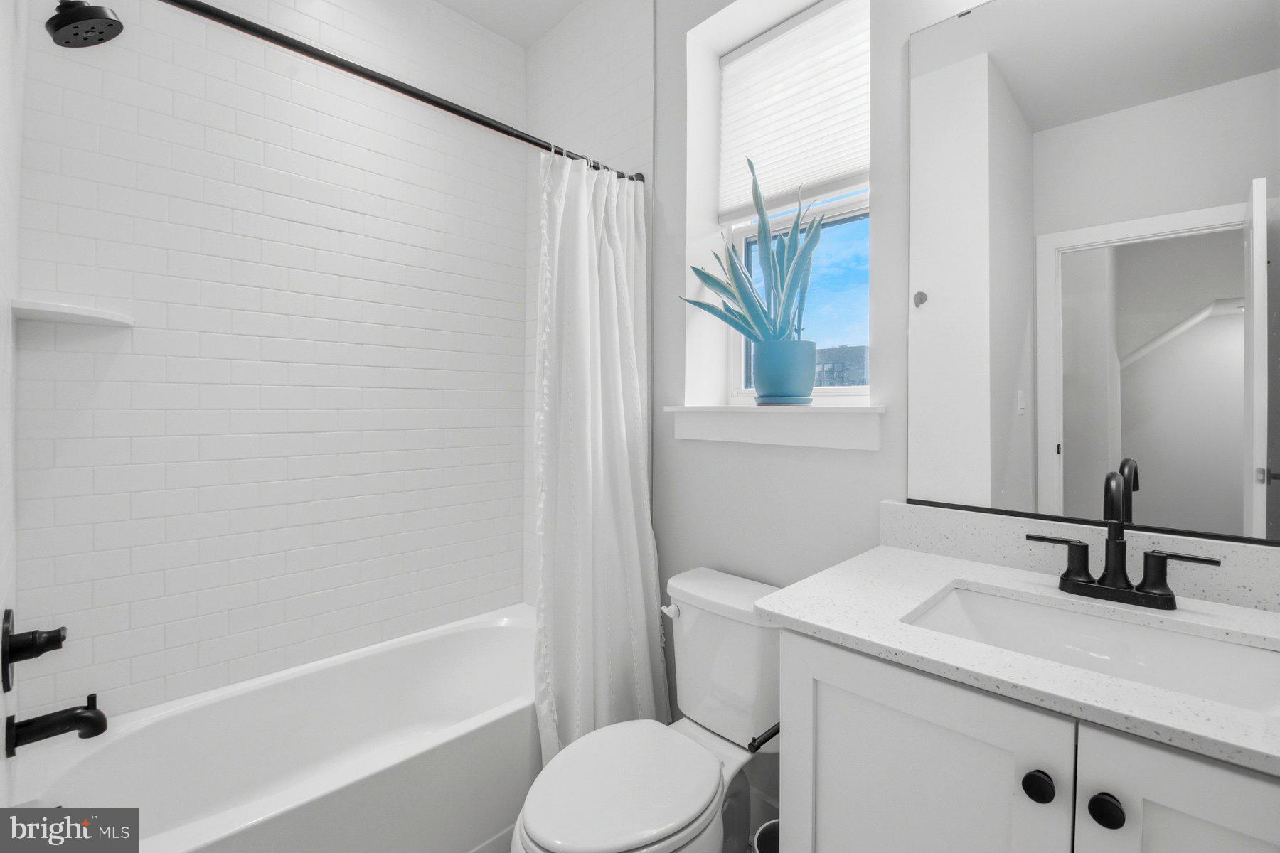 100 Glass Lane Baltimore, MD 21230 - Photo 19 of 36 a bathroom with a sink toilet and shower
