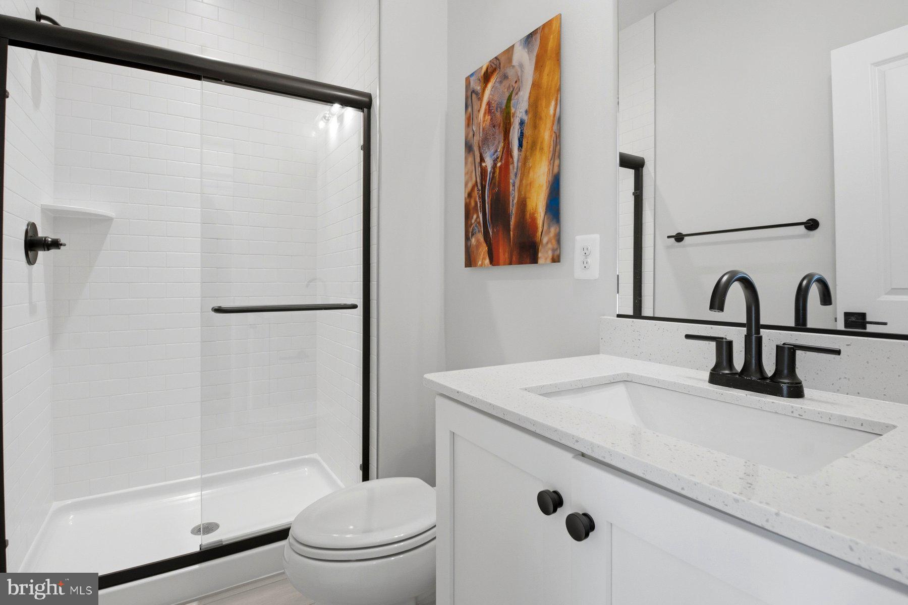 100 Glass Lane Baltimore, MD 21230 - Photo 6 of 36 a bathroom with a sink toilet and shower