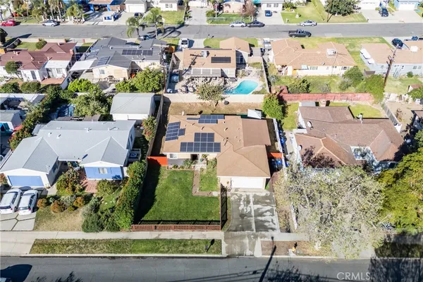 an aerial view of residential houses with outdoor space