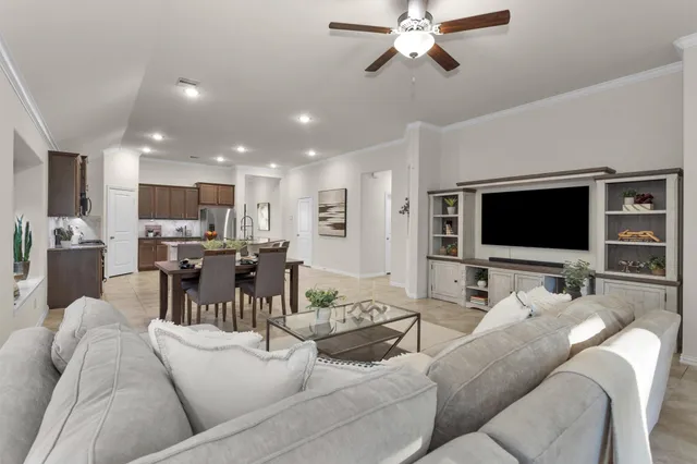 a living room with furniture and a flat screen tv