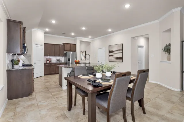 a view of a dining room with furniture