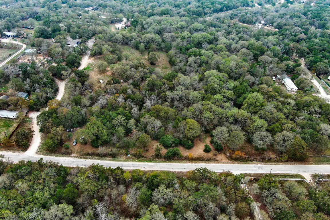 233 The Forest Road Dale, TX 78616 - Photo 13 of 15 a view of a field of grass and trees