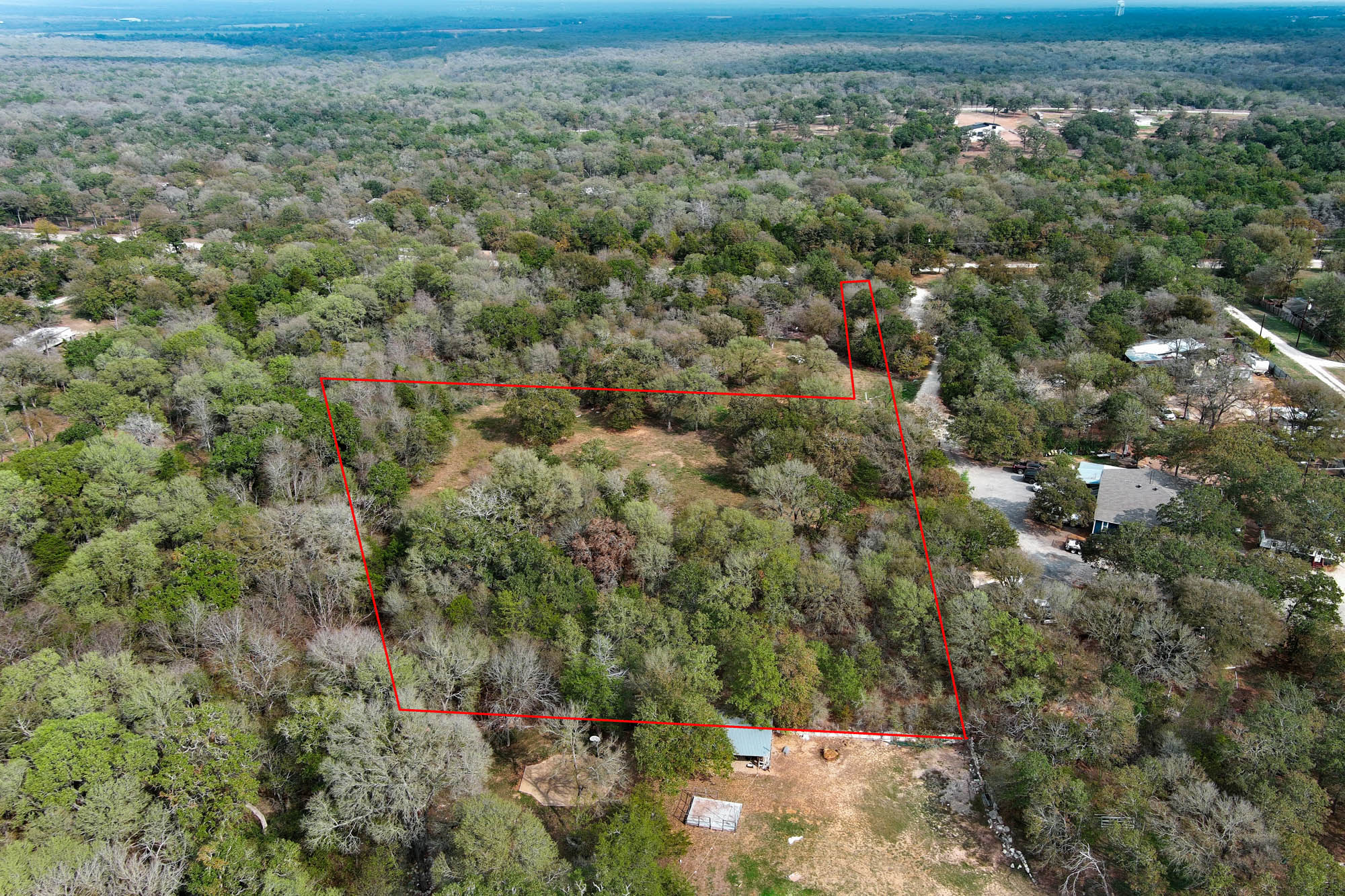 233 The Forest Road Dale, TX 78616 - Photo 4 of 15 Aerial view of property and surrounding area featuring property boundaries highlighted