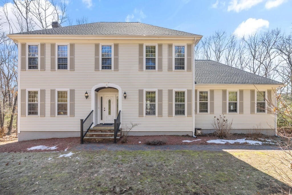a front view of a house with a yard