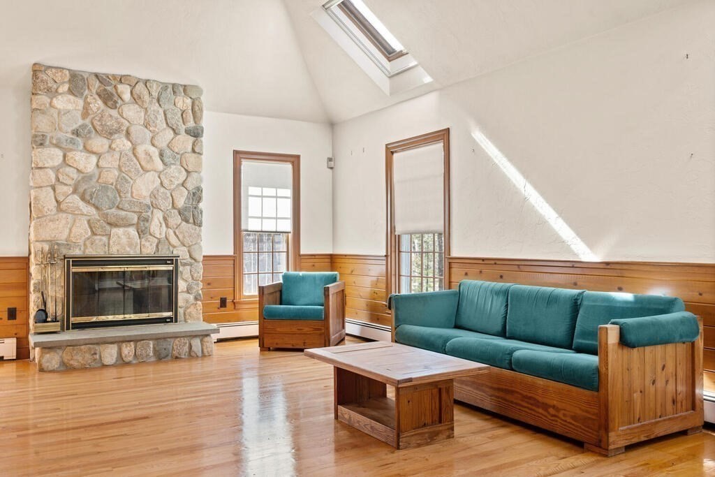 3 Royal Circle Lexington, MA 02420 - Photo 11 of 42 a living room with furniture and a fireplace