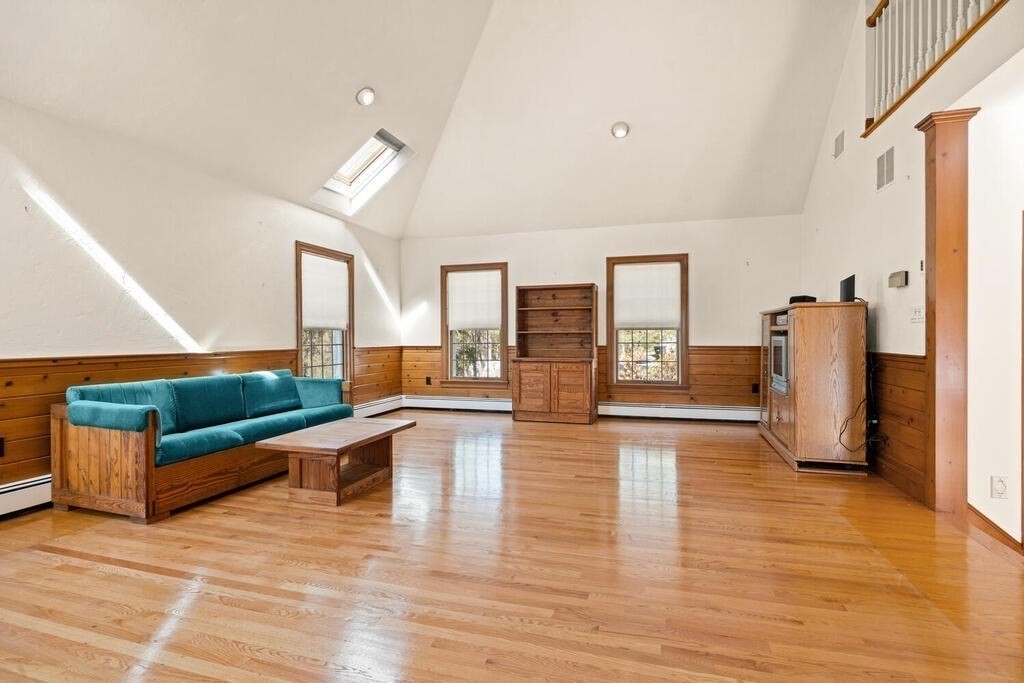 3 Royal Circle Lexington, MA 02420 - Photo 12 of 42 a living room with furniture and a wooden floor