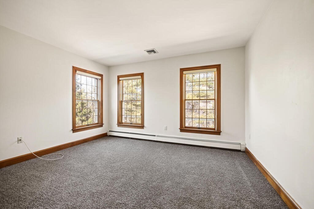 3 Royal Circle Lexington, MA 02420 - Photo 20 of 42 an empty room with windows