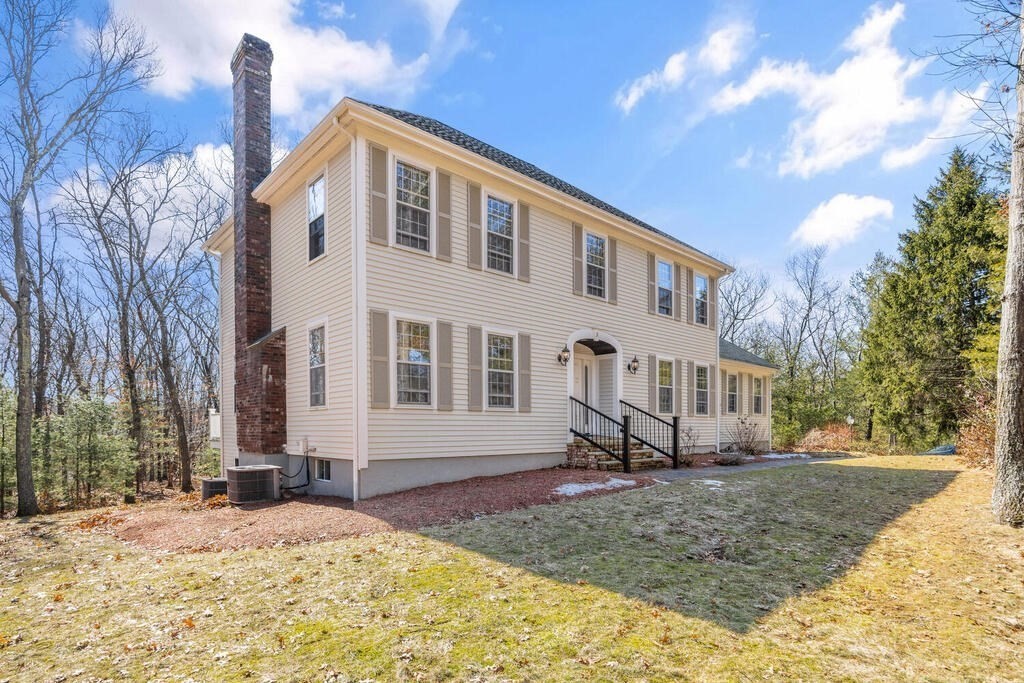 3 Royal Circle Lexington, MA 02420 - Photo 2 of 42 a front view of a house with a yard