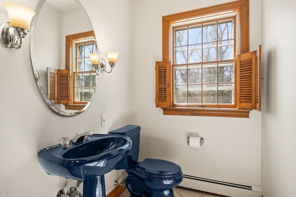 3 Royal Circle Lexington, MA 02420 - Photo 25 of 42 a bathroom with a toilet a sink and mirror