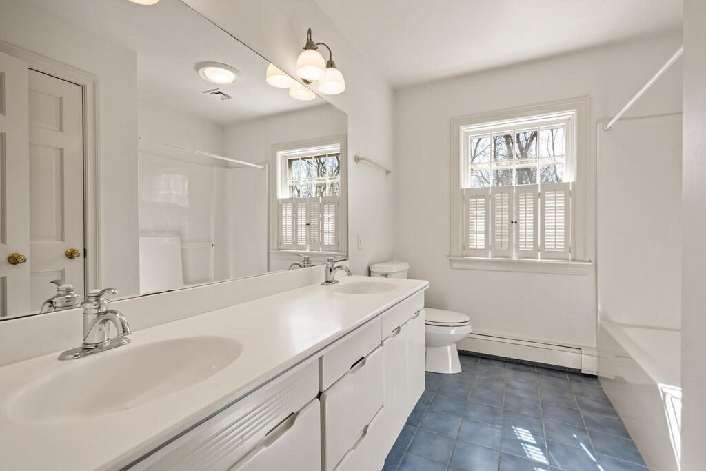 3 Royal Circle Lexington, MA 02420 - Photo 27 of 42 a bathroom with a sink a toilet and a mirror