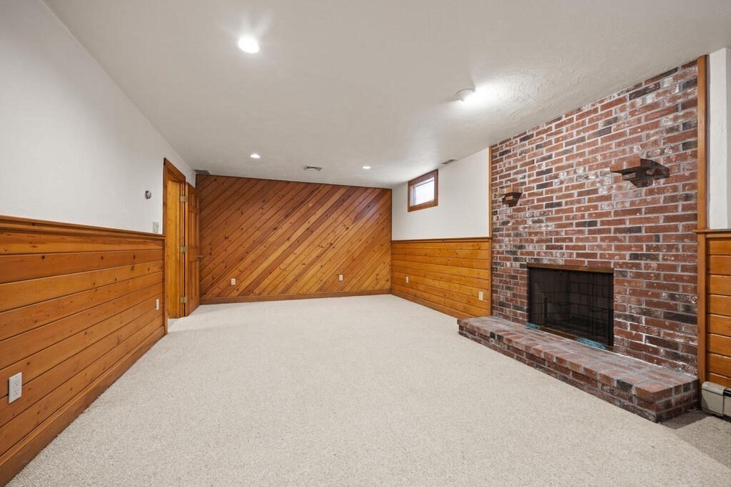 3 Royal Circle Lexington, MA 02420 - Photo 30 of 42 a view of an empty room with a fireplace