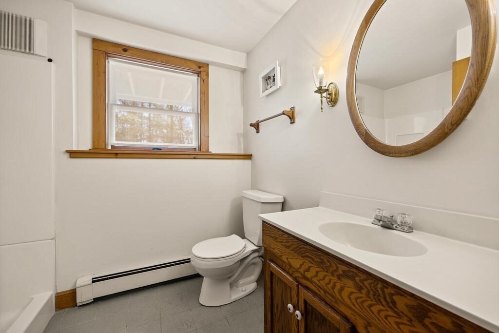 3 Royal Circle Lexington, MA 02420 - Photo 33 of 42 a bathroom with a sink a toilet and a mirror