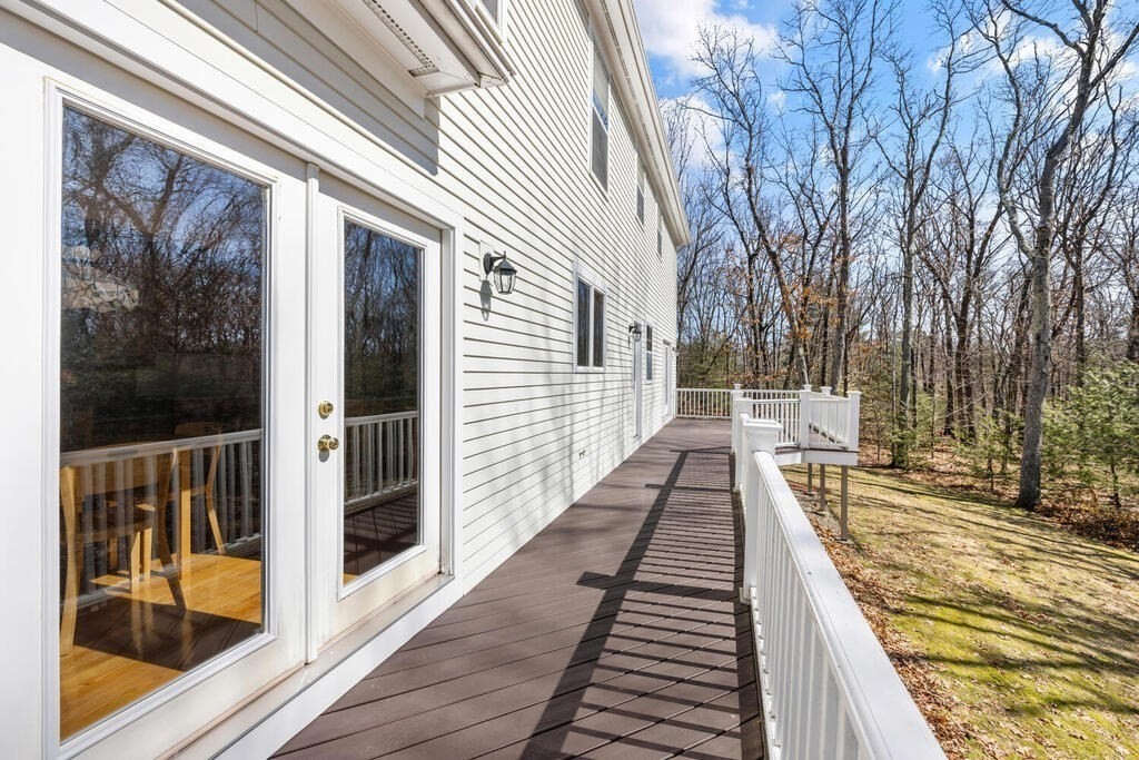 3 Royal Circle Lexington, MA 02420 - Photo 34 of 42 a view of balcony with two chairs and wooden floor