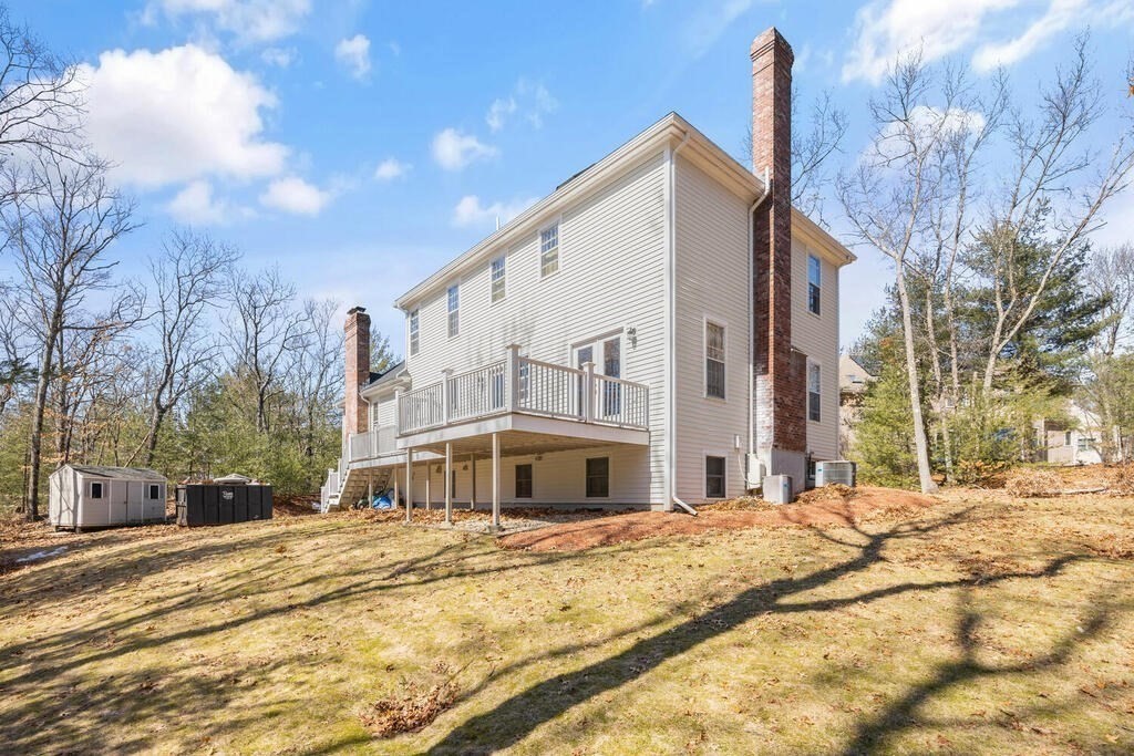 3 Royal Circle Lexington, MA 02420 - Photo 37 of 42 a view of a building with snow on the road