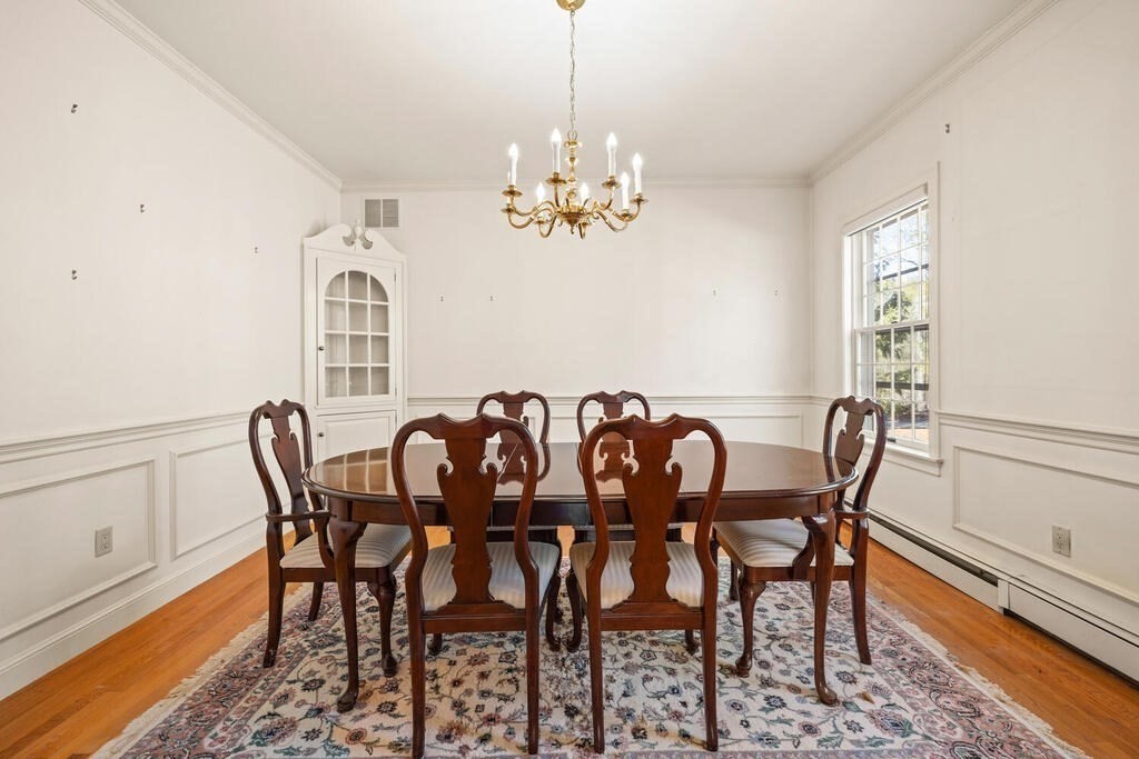 3 Royal Circle Lexington, MA 02420 - Photo 4 of 42 a view of a dining room with furniture wooden floor and a chandelier