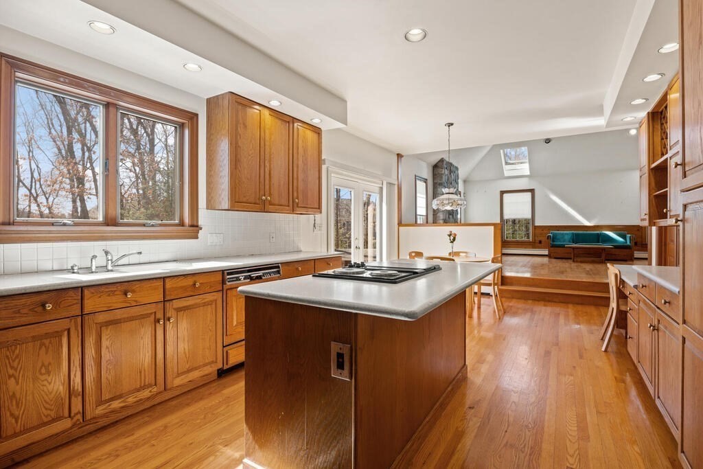 3 Royal Circle Lexington, MA 02420 - Photo 7 of 42 a kitchen with wooden cabinets and sink