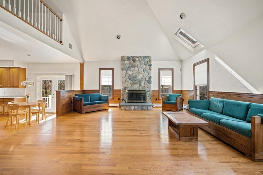 3 Royal Circle Lexington, MA 02420 - Photo 9 of 42 a living room with furniture and a fireplace