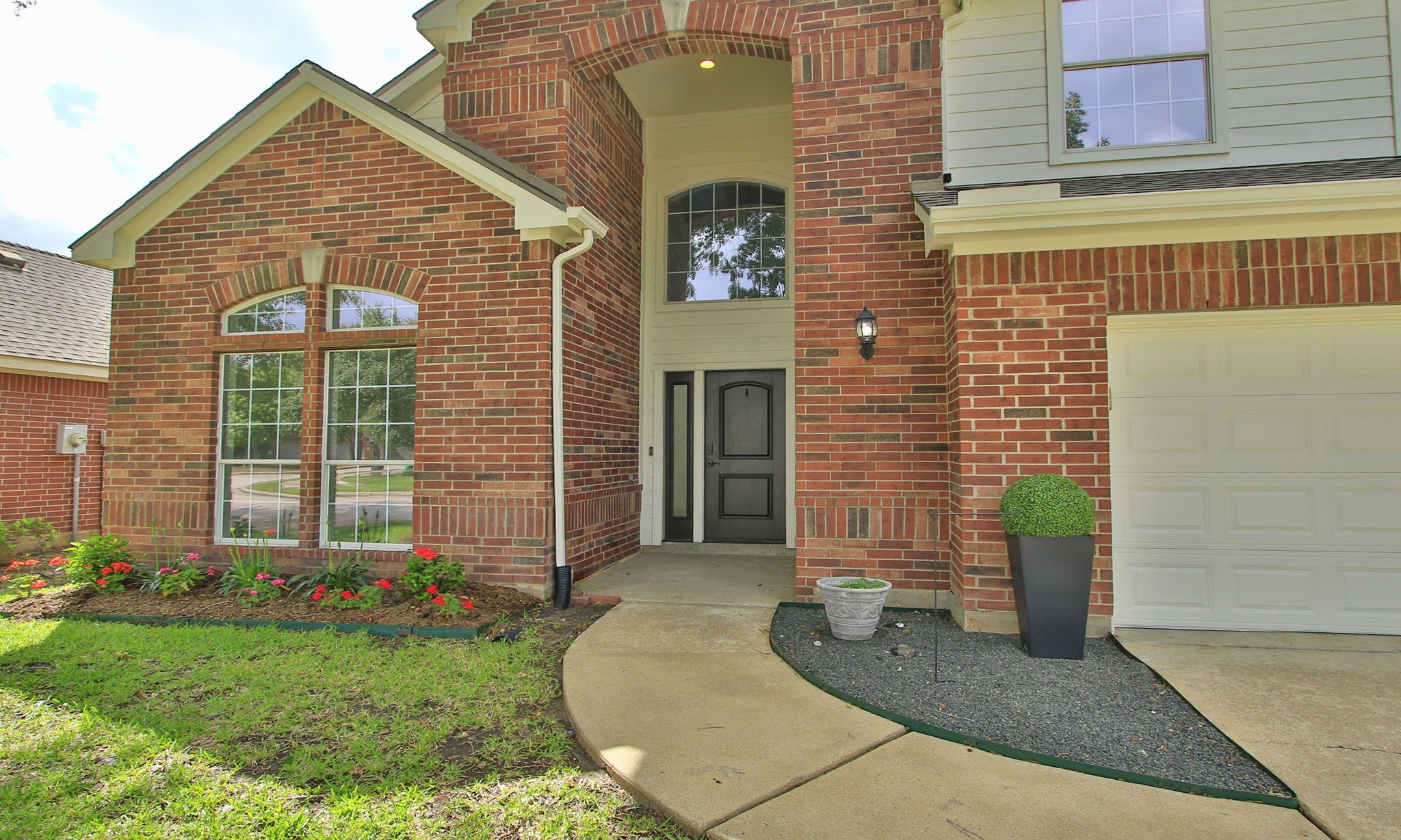 1210 Berwick Manor Court Spring, TX 77379 - Photo 1 of 50 a front view of a house with garden
