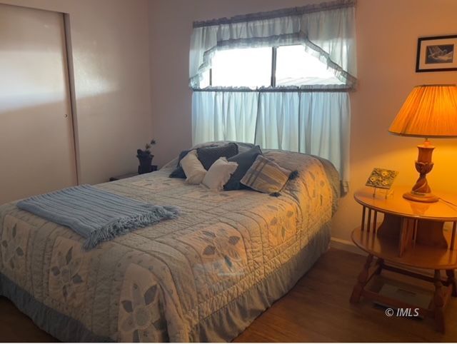 2263 Darby Avenue Bishop, CA 93514 - Photo 14 of 23 a bedroom with a bed and a window