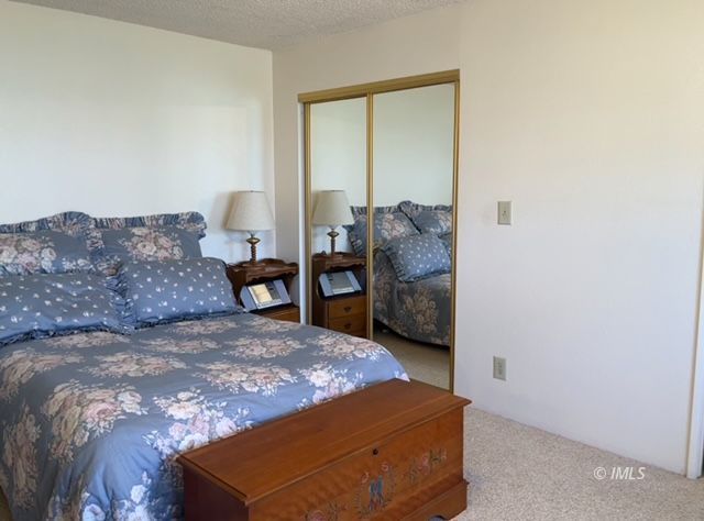 2263 Darby Avenue Bishop, CA 93514 - Photo 17 of 23 a large bed sitting in a bedroom next to a window