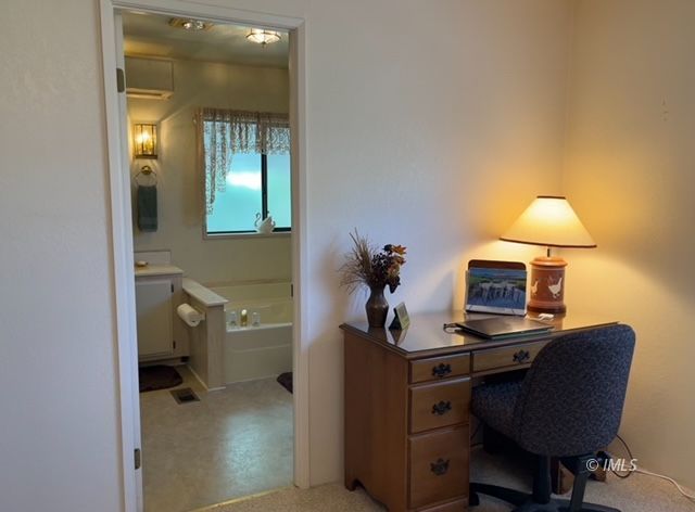 2263 Darby Avenue Bishop, CA 93514 - Photo 21 of 23 a bathroom with a toilet a sink and mirror