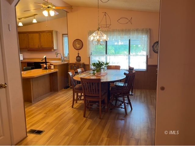 2263 Darby Avenue Bishop, CA 93514 - Photo 7 of 23 a view of a dining room with furniture and wooden floor