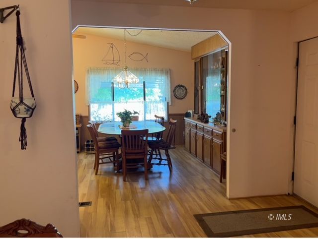 2263 Darby Avenue Bishop, CA 93514 - Photo 9 of 23 a view of a dining room with furniture window and wooden floor