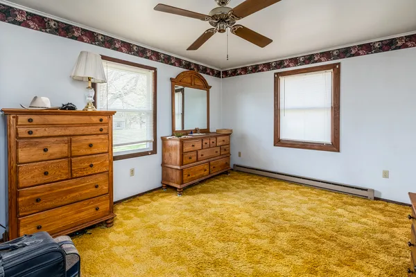 a view of room with window and cabinet