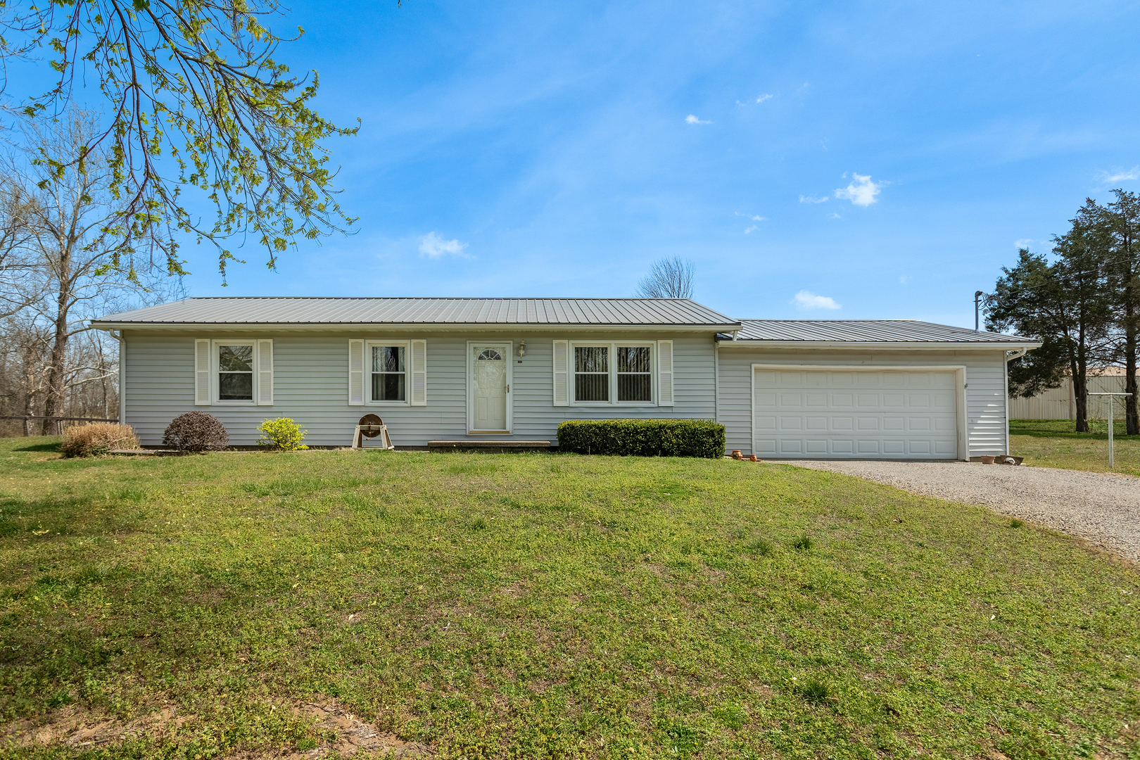 306 White Street Creal Springs, IL 62922 - Photo 2 of 36 a front view of a house with a garden