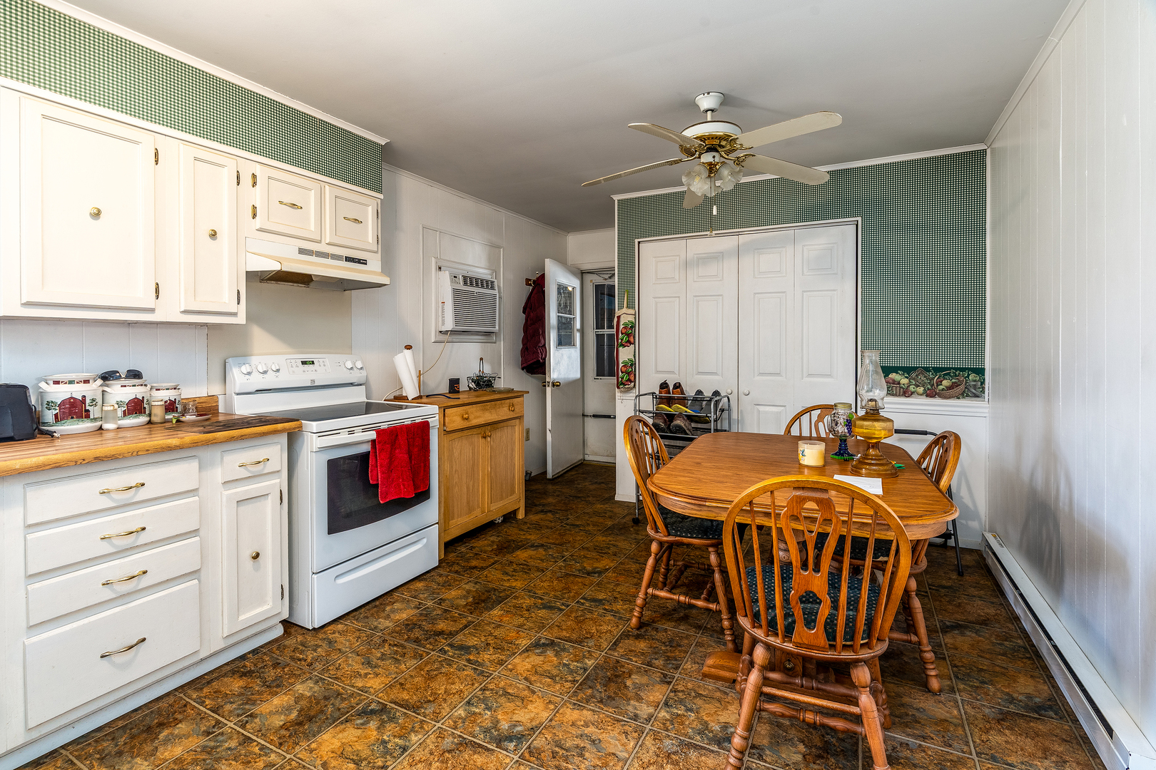 306 White Street Creal Springs, IL 62922 - Photo 9 of 36 a kitchen with stainless steel appliances kitchen island granite countertop a stove a sink and a refrigerator