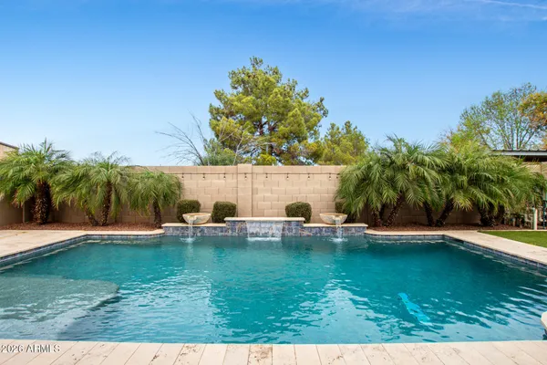 a view of a swimming pool with a patio